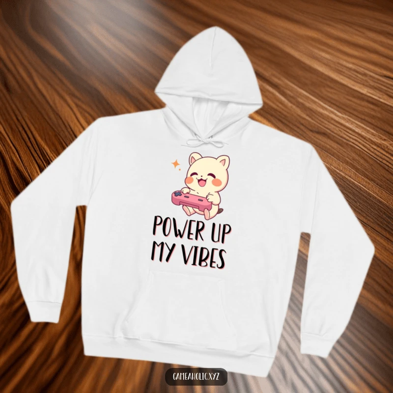 Funny Hoodie featuring a small creature joyfully mashing game controller buttons, perfect for cozy gaming.