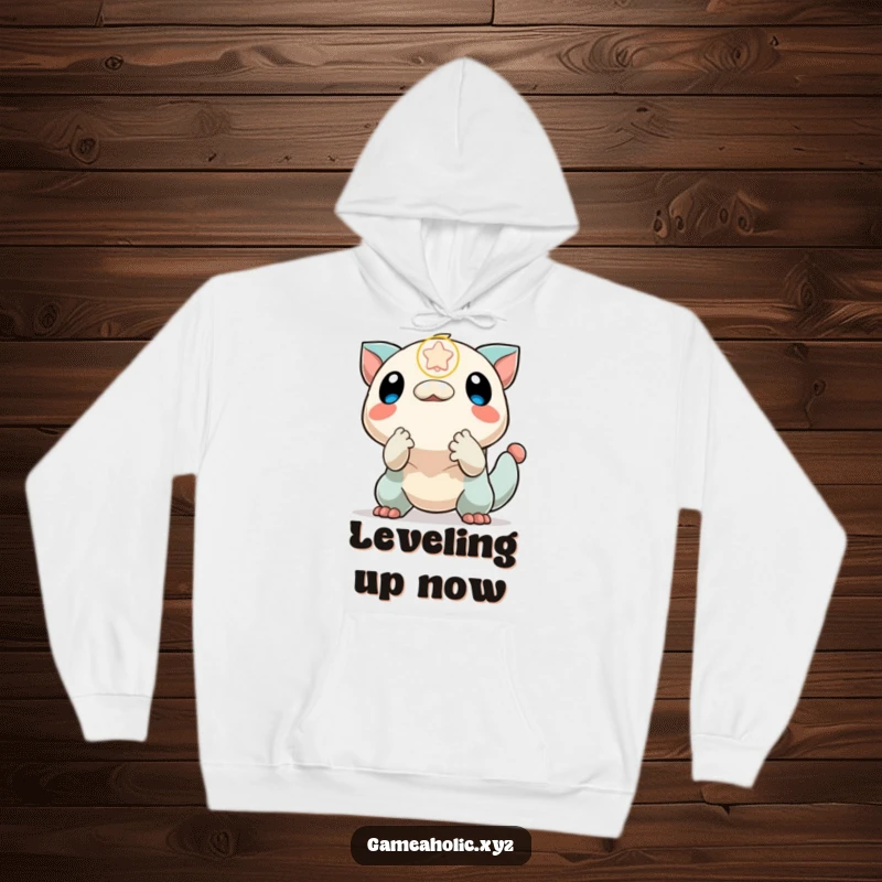 Funny hoodie with a creature enthusiastically reaching for a power-up icon, symbolizing the pursuit of victory and in-game rewards.